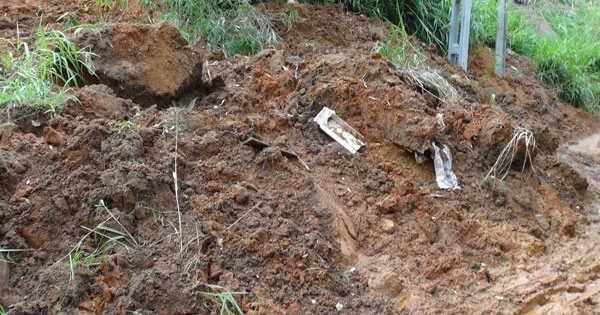 cemetery-landslide-bodies-exposed